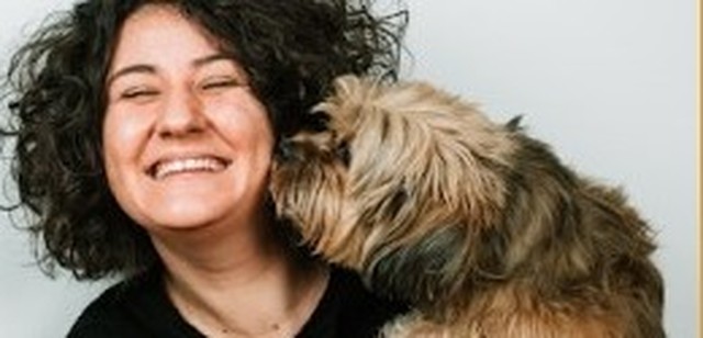 Pet owner with her dog, representing the PetSmart Medical case study